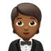 🤵🏾 person in tuxedo: medium-dark skin tone display on Apple